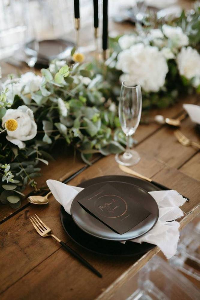 Romantic reception table setup with candlelight and terracotta tones at Intle Boutique Hotel